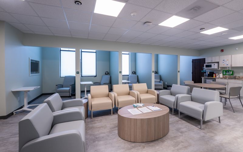 The Crisis Stabilization Center of Upstate Caring Partners in Utica offers a comfortable spot with immediate care for people experiencing mental health or substance use crises. The waiting room, seen in this photo, includes armchairs, sofas and recliners.