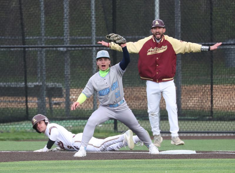 Arlington’s George Simon safe at first as John Jay’s Anthony Batkay challenges the call during Tuesday’s game on April 21, 2026.