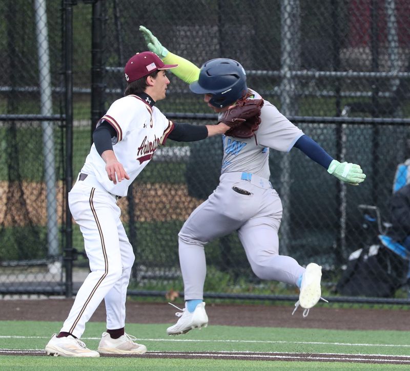 Action from Tuesday’s baseball game between John Jay and Arlington on April 21, 2026.