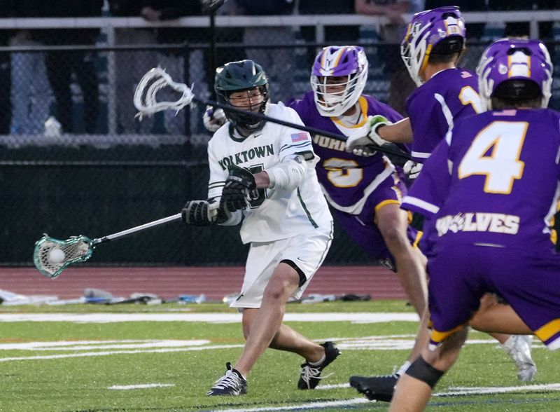 Yorktown’s Tyler Caricati (5) fires a shot during game against John Jay at Yorktown High School April 21, 2026. Yorktown won the game.
