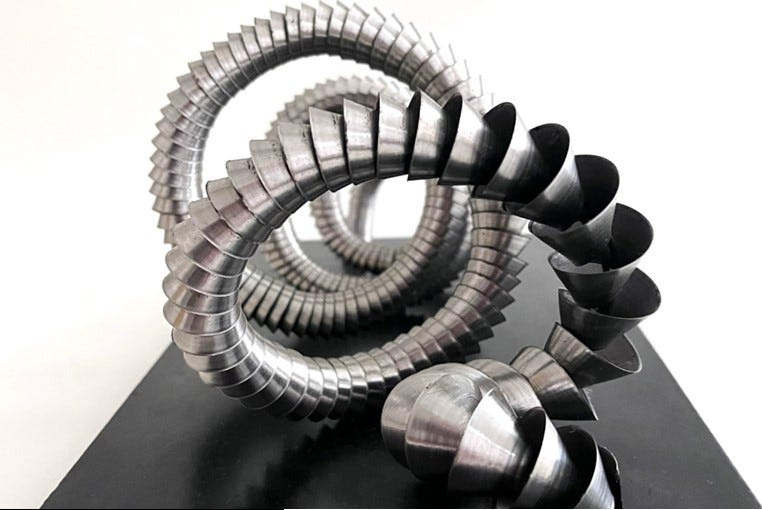 Sculpture created from scrap metals mined from annual Earth Day scavenge at Empire Recycling corporate offices, main yard complex to be part of "Earth Day Collection" exhibited, sold annually at CHAIRity auction, proceeds supporting Sculpture Space artists, programs.