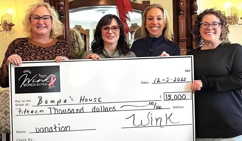 Representatives from Bampa's House show off a $15,000 check from Women in Pink, an affiliate of the Josh Palmer Fund that supports women diagnosed with breast cancer. The Josh Palmer Fund also gave $7,500 to Bampa's House.