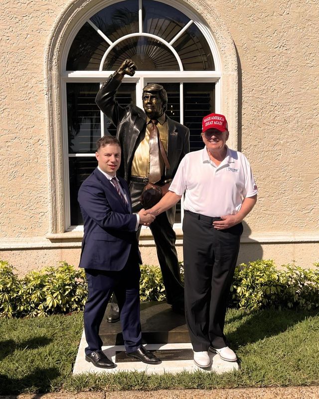 Amsterdam, NY businessman Anthony Constantino poses with President Donald Trump, April 12, 2025, Trump International Golf Club in Palm Beach, FL after gifting the president a 7-foot bronze statue, with Constantino's name engraved in stone base, to be installed at club.