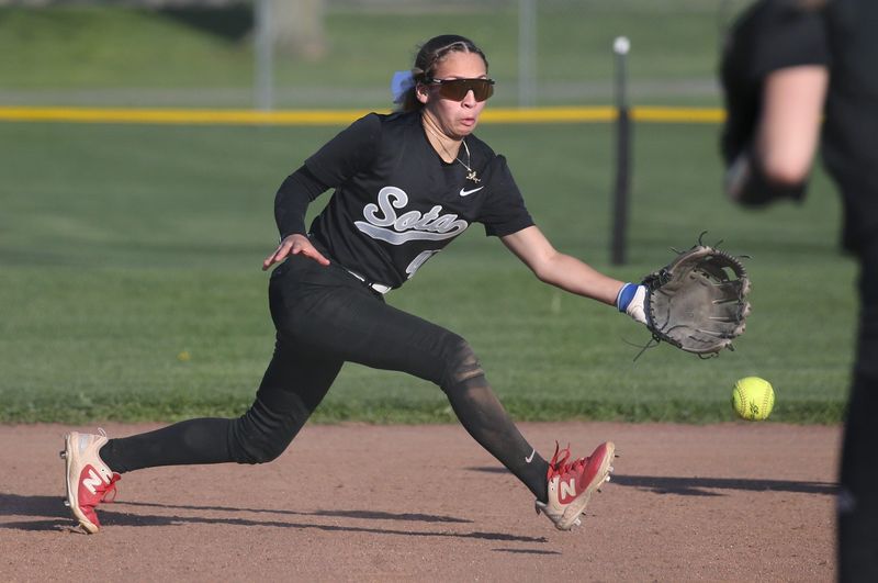 SOTA short stop Avielise Martinez knocks down a grounder up the middle but is unable to get East Rochester’s Bailey Morrison at first in the fifth inning during their Section V softball game Wednesday, April 22, 2026 at East Rochester High School.