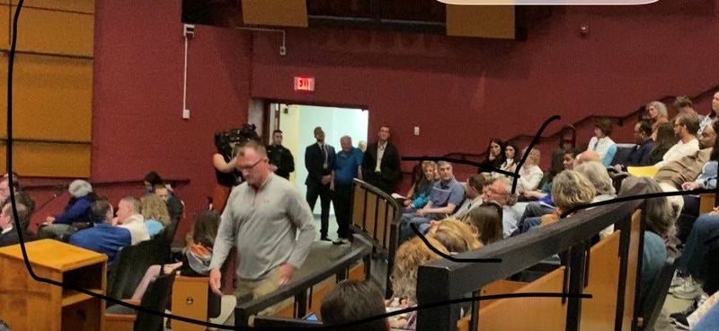 Robert Baumgarten walks to the podium to speak during a community forum April 22 in the Clinton High School theater. The Oneida County Sheriff's Office uncovered a plot for a potential mass shooting in the middle school and arrested three teens.