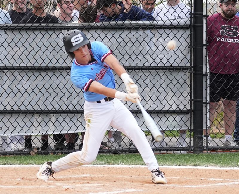 Scarsdale's Max Gashalter (10) connects with a pitch during baseball action against Mamaroneck at Scarsdale High School in Scarsdale on Thursday, April 23, 2026. Scarsdale won 4-0.