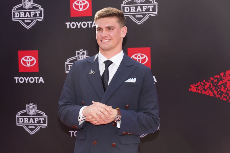 Alabama Crimson Tide quarterback Ty Simpson poses on the red carpet before the 2026 NFL Draft at Point State Park.