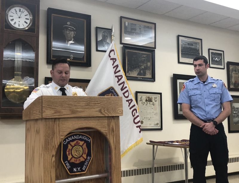 Canandaigua Fire Chief Frank Magnera recognizes Kevin Frederes as Firefighter of the Year.