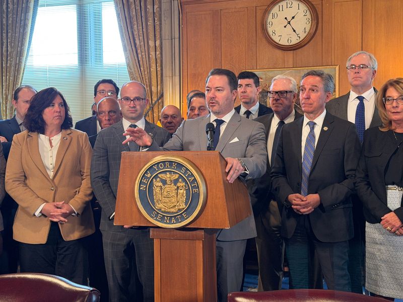 Senate Minority Leader Rob Ortt, center, is joined by Assembly Minority Leader Ed Ra and several other Albany Republican lawmakers inside the New York State Capitol on Monday, April 20, 2026.