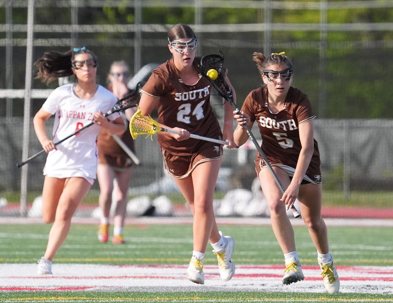 Clarkstown South's Ava Galati (24) looks to gather a loose ball during a girls lacrosse game against Tappan Zee on April 24, 2026.