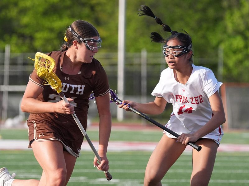 Clarkstown South's Ava Galati drives against a Tappan Zee defender during an April 24, 2026 girls lacrosse game.