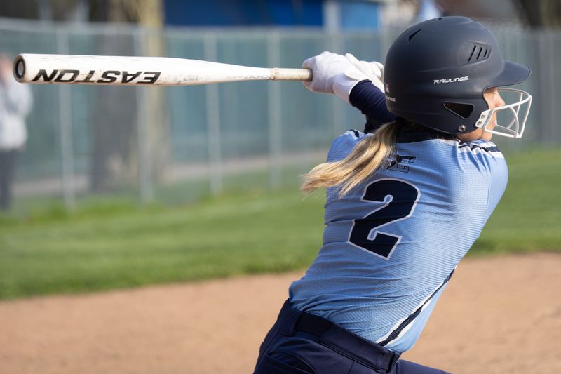 Eastridge's Taylor Schmidt puts the ball in play Friday, April 24 at Irondequoit High School.