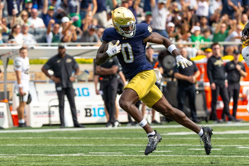 Sep 20, 2025; South Bend, Indiana, USA; Notre Dame Fighting Irish wide receiver Malachi Fields (0) runs after making a catch at Notre Dame Stadium. Mandatory Credit: Michael Caterina-Imagn Images