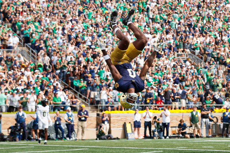 Notre Dame wide receiver Malachi Fields flips through the air after scoring a touchdown during the first half of a NCAA football game against Purdue at Notre Dame Stadium on Saturday, Sept. 20, 2025, in South Bend.