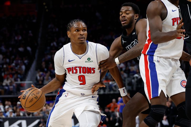 Feb 1, 2026; Detroit, Michigan, USA; Detroit Pistons guard Ausar Thompson (9) dribbles defended by Brooklyn Nets forward Jalen Wilson (22) in the second half at Little Caesars Arena. Mandatory Credit: Rick Osentoski-Imagn Images