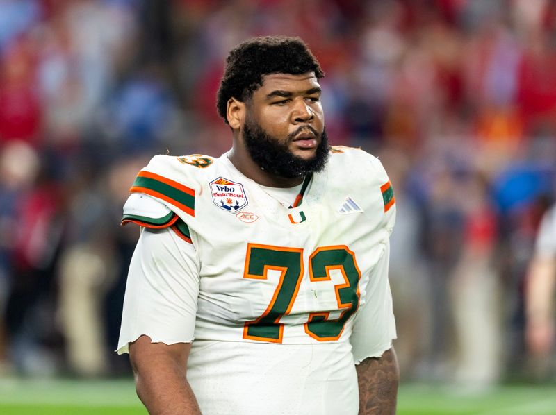 Jan 8, 2026; Glendale, AZ, USA; Miami Hurricanes offensive lineman Anez Cooper (73) against the Mississippi Rebels during the 2026 Fiesta Bowl and semifinal game of the College Football Playoff at State Farm Stadium. Mandatory Credit: Mark J. Rebilas-Imagn Images