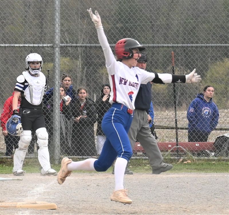New Hartford Spartan Norah Galiulo throws her arms in the air in celebration while rounding first base after hitting a home run against Frontier during NYSSCOGS' annual Officer Joseph Corr Memorial Tournament Saturday at the Mudville complex in Herkimer.