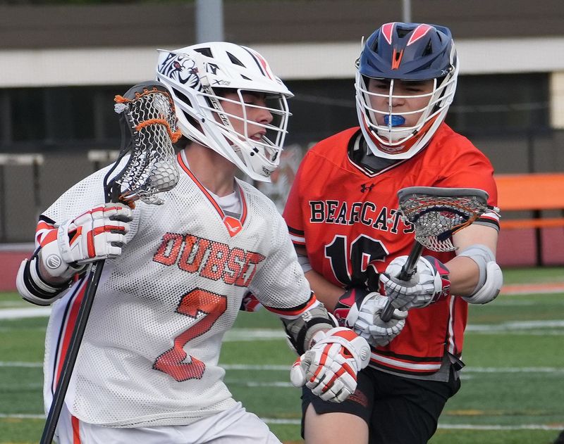 White Plains’ Patrick Dooley (2) tries to get around Briarcliff/Croton’s Ryan Grower (16) battle for a faceoff during boys lacrosse action at White Plains High School April 23, 2026. White Plains won the game 15-3.