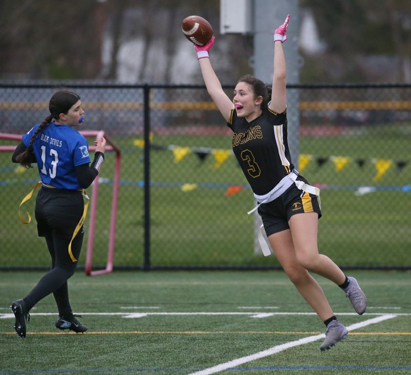 Athena’s Bryana Orlando celebrates in the end zone after scoring in the third quarter, putting Athena up 12-0 during their Section V flag football game Tuesday, April 28, 2026 at Greece Athena High School.
