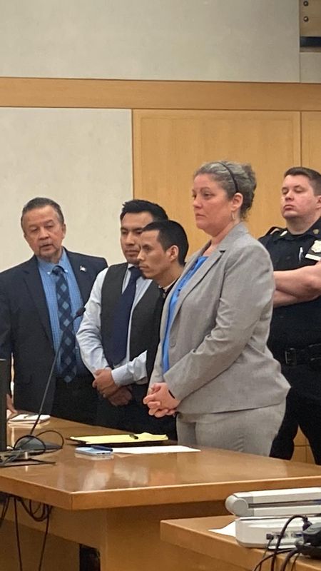 Hugo Perez-Gabriel, third from left, in Westchester County Court on April 30, 2026. He was sentenced to nine to 19 years in prison for his guilty pleas to use of a child in a sexual performance, criminal sex act and tampering with evidence for his sexual misconduct involving a 15-year-old boy and moving the boy's body from his New Rochelle home after he'd died from acute intoxication
