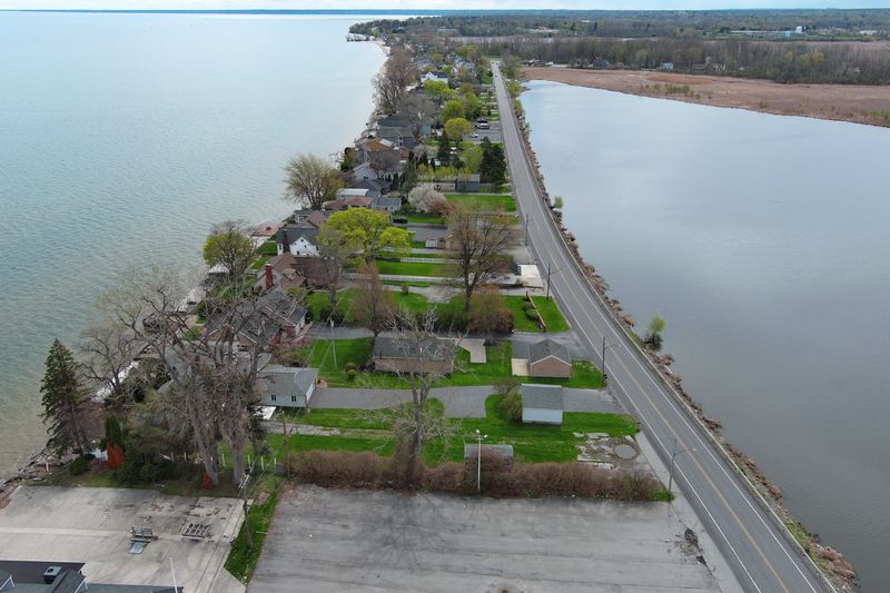 Lake Ontario and nearby ponds along Edgemere Drive in Greece are high on May 1, 2026. A view of looking east.