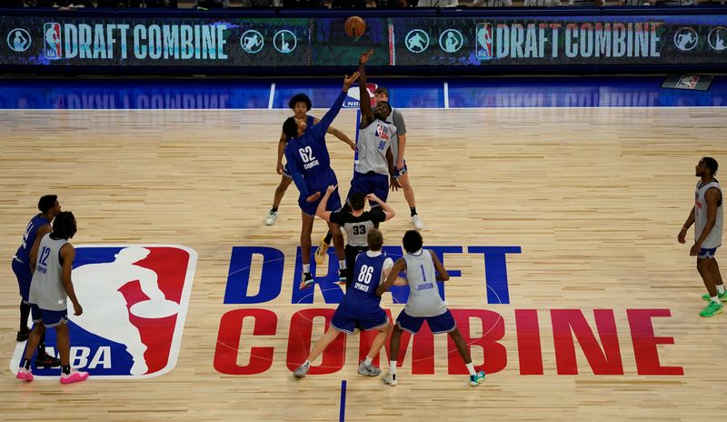 May 14, 2024; Chicago, IL, USA; Adam Bona (90) and Urich Chomche (62) go for a jump ball during the 2024 NBA Draft Combine at Wintrust Arena. Mandatory Credit: David Banks-USA TODAY Sports