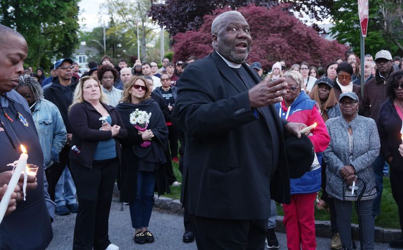 Rev. Dr. Tyrone H. Robinson of First Community Baptist Church in Greenberg speaks to the large gathering during a candlelight vigil on Parkway Homes Road in Greenburgh to mourn 76-year-old Robert Watson, his daughter Cherika Johnson, 50, and her 23-year-old son Jaden Johnson May 2, 2026. The family members were found dead from gunshot wounds on April 30 in an apparent murder-suicide, which police believe was an isolated domestic violence incident.