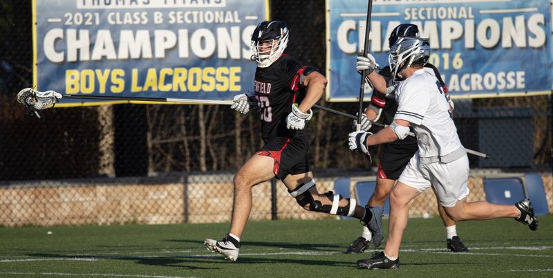 Penfield's AJ Theodorakakos runs with the ball Monday, April 27 at Webster Thomas.