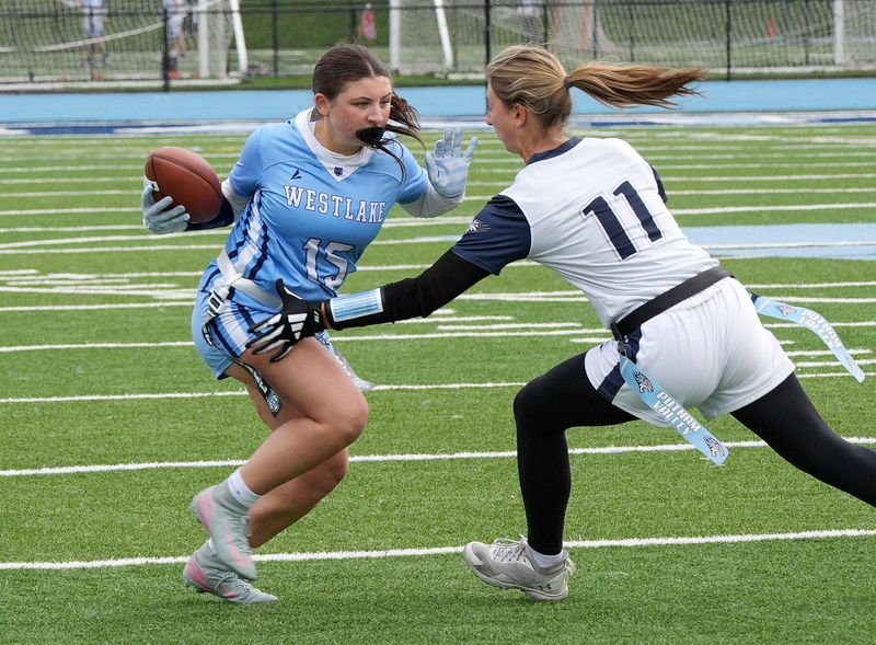 Westlake/Briarcliff’s Julianna Nigrell (15) tries to get around Putnam Valley’s Lily Johnson (11) during a flag football game at Westlake High School in Thornwood April 30, 2026.