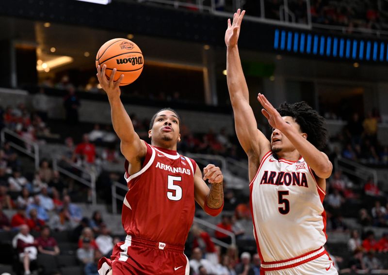 Mar 26, 2026; San Jose, CA, USA; Arkansas Razorbacks guard Darius Acuff Jr. (5) shoots past Arizona Wildcats guard Brayden Burries (5) in the second half during a Sweet Sixteen game of the West Regional of the men's 2026 NCAA Tournament at SAP Center. Mandatory Credit: Eakin Howard-Imagn Images