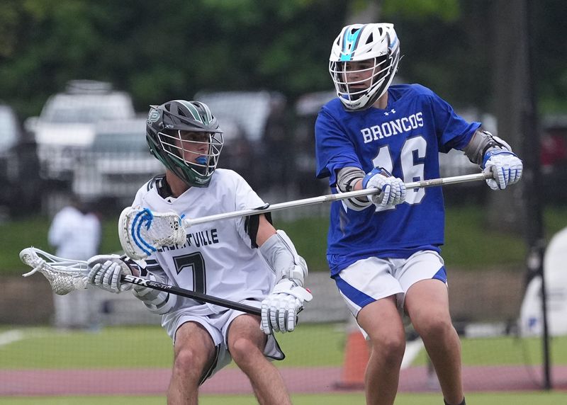 Pleasantville's Matteo Petticcione (7) works against Bronxville's Will Malloy (16) during boys lacrosse action at Pleasantville High School on Wednesday, May 6, 2026. Pleasantville won 11-9.