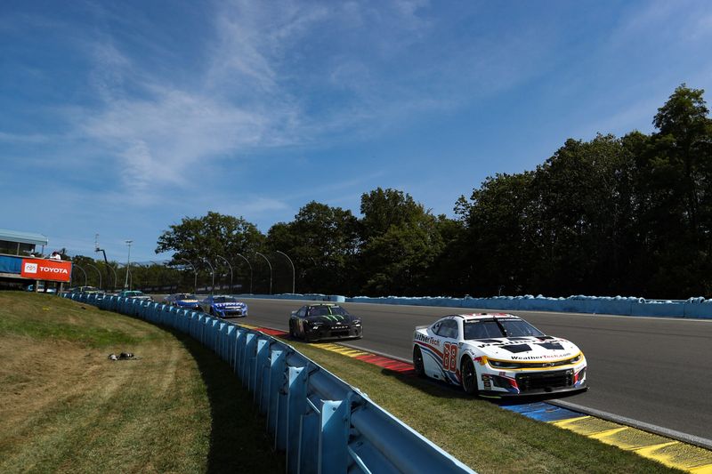Aug 10, 2025; Watkins Glen, New York, USA; NASCAR Cup Series driver Shane Van Gisbergen (88) races during the Go Bowling at The Glen at Watkins Glen International.