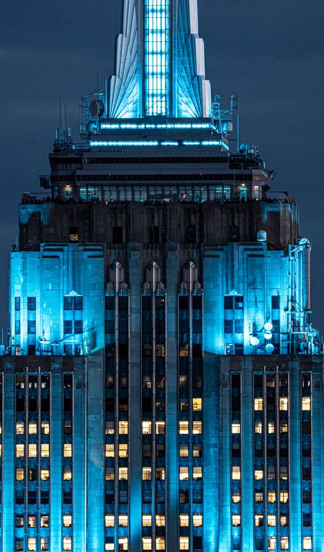 The Empire State Building lit in blue, seen from the 70th floor of the Top of the Rock observatory at Rockefeller Plaza May 7, 2026.