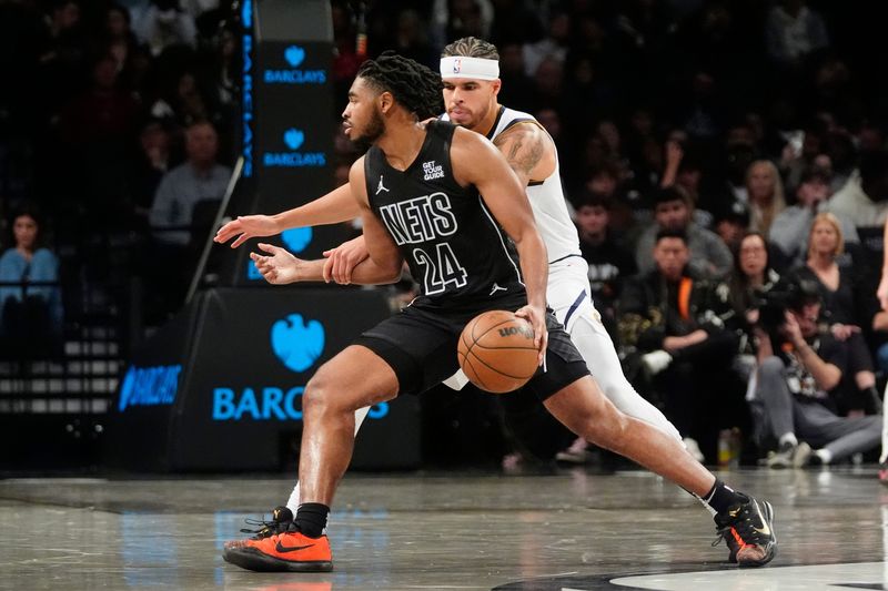 Oct 29, 2024; Brooklyn, New York, USA; Brooklyn Nets small guard Cam Thomas (24) dribbles the ball against Denver Nuggets small forward Michael Porter Jr. (1) during the first half at Barclays Center. Mandatory Credit: Gregory Fisher-Imagn Images
