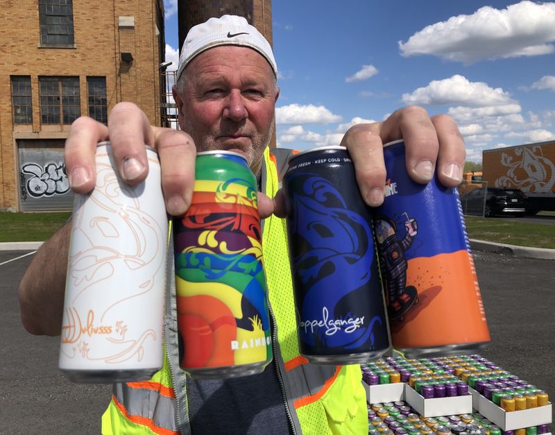 Brian Speck shows what you get from Tree House Brewing, a Massachusetts-based brewery that is having a pop-up sale in Rochester on May 8 and May 9.