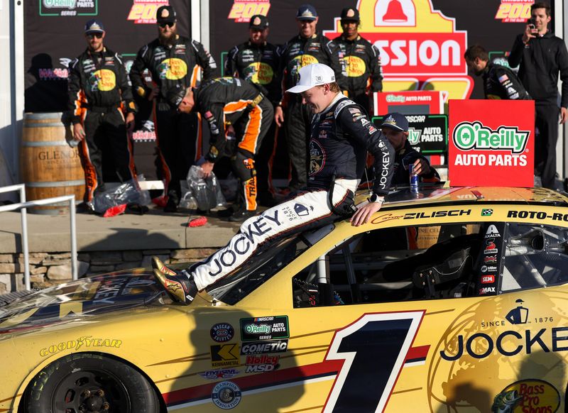 May 9, 2026; Watkins Glen, New York, USA; NASCAR O’Reilly Auto Parts Series driver Connor Zilisch slides off of his car in victory lane after winning the Mission 200 at Watkins Glen International. Mandatory Credit: Matthew O'Haren-Imagn Images