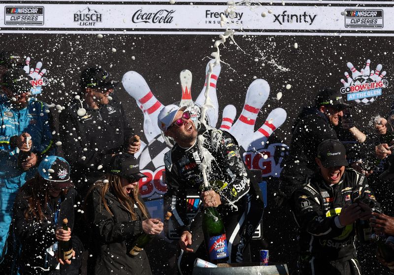 May 10, 2026; Watkins Glen, New York, USA; NASCAR Cup Series driver Shane Van Gisbergen celebrates in victory lane after winning the Go Bowling at The Glen at Watkins Glen International. Mandatory Credit: Matthew O'Haren-Imagn Images