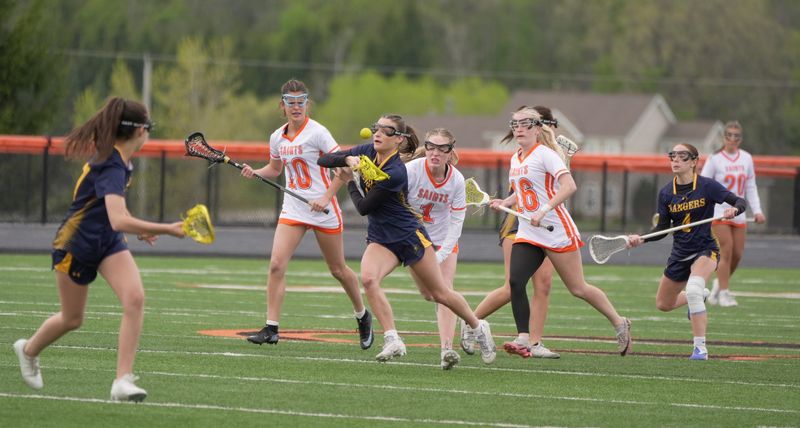 Spencerport's Joey Cerretto tries to get control of the ball while Churchille-Chili's Mercy Payne, Alaina Podszebka, and Shavonne Callahan are close on her heels also going for the ball during their game at the Churchville-Chili High School field in Churchville on May 12, 2026.
