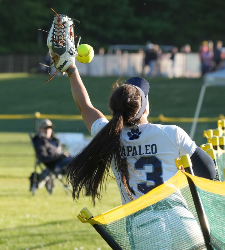 Ursuline's Ava Papaleo crashes through the outfield fence just missing catching a home run May 12, 2026. Albertus Magnus softball won 8-5.