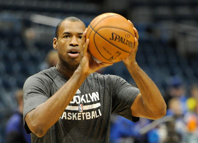 Mar 1, 2014; Milwaukee, WI, USA; Brooklyn Nets center Jason Collins (98) warms up before game against the Milwaukee Bucks at BMO Harris Bradley Center. Mandatory Credit: Benny Sieu-USA TODAY Sports