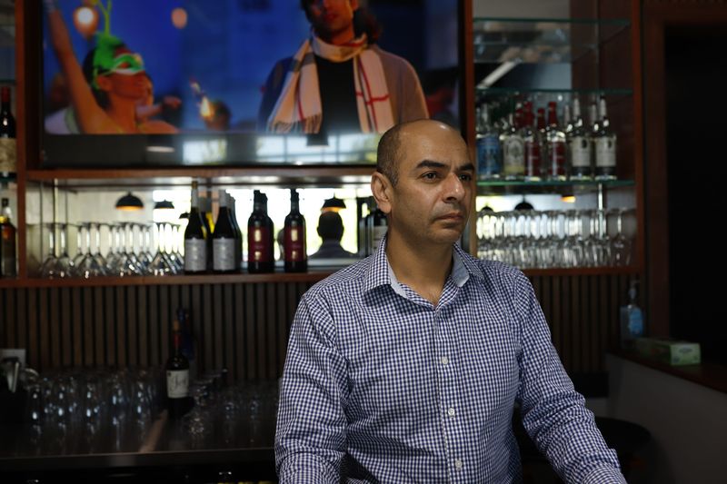 Co-owner Sukhbir Singh stands at the bar on May 12, 2026, at Aroma Indian Kitchen & Bar, which opened in Goshen on April 30, 2026.
