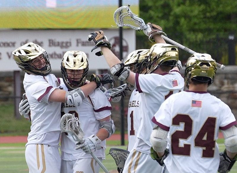 Iona Prep’s Tim Plunkett (20) and Billy Haggerty (10) after record breaking goal during game against Stepinac during the CHSAA lacrosse playoff action at Iona Prep in New Rochelle May 14, 2026. Iona won the game 16-7.
