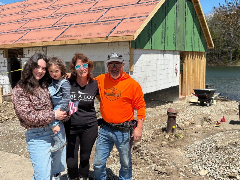 Chuck and Joanne Cavallaro are rebuilding the Laf-A-Lot bar and restaurant on the edge of Loon Lake. The couple is pictured here with their daughter, Marisa Reask, and their grandchild, Rome Reask.