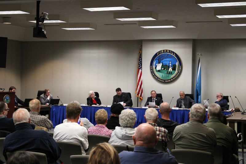 Fishkill residents gathered a May 13 special Fishkill Town Board meeting, and at the front of the room, from left, is Town Clerk Cooper Leatherwood, Council Member Jacqueline Bardini, Council Member Greg Totino, Supervisor Ozzy Albra, Council Member Donald Przytula and Council Member Brian Wrye.