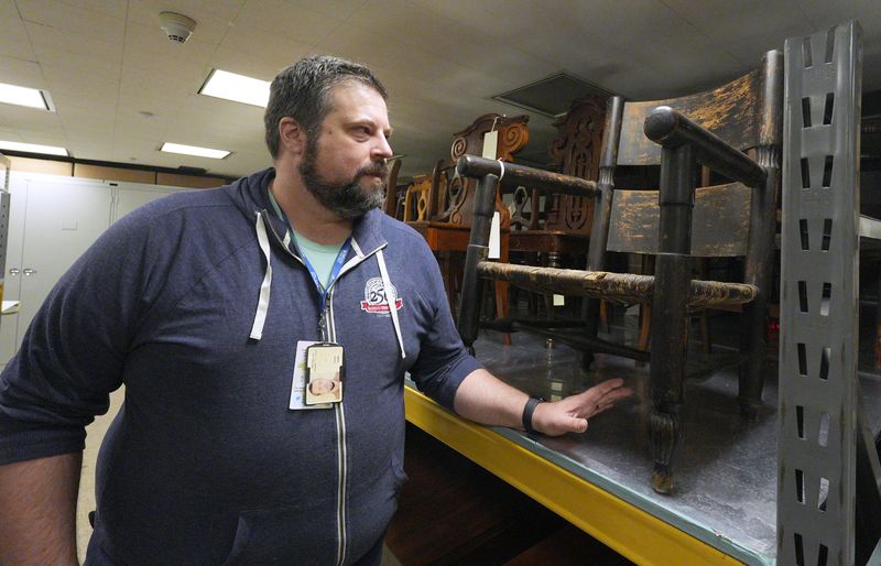 Senior Historian Aaron Noble with a chair that belonged to New York Governor Theodore Roosevelt's sister, in storage at the New York State Museum in Albany May 14, 2026.
