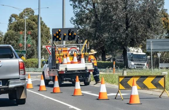 Signage for a road construction project.
