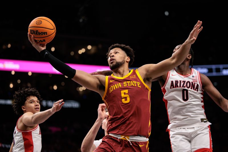 Mar 13, 2026; Kansas City, MO, USA; Iowa State Cyclones forward Joshua Jefferson (5) rebounds during the second half against the Arizona Wildcats at T-Mobile Center. Mandatory Credit: William Purnell-Imagn Images