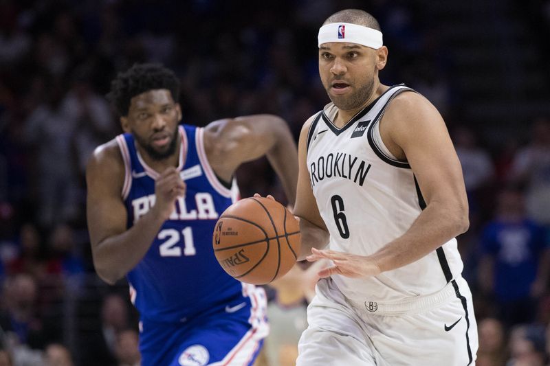 Apr 13, 2019; Philadelphia, PA, USA; Brooklyn Nets forward Jared Dudley (6) dribbles past Philadelphia 76ers center Joel Embiid (21) during the fourth quarter in game one of the first round of the 2019 NBA Playoffs at Wells Fargo Center. Mandatory Credit: Bill Streicher-USA TODAY Sports