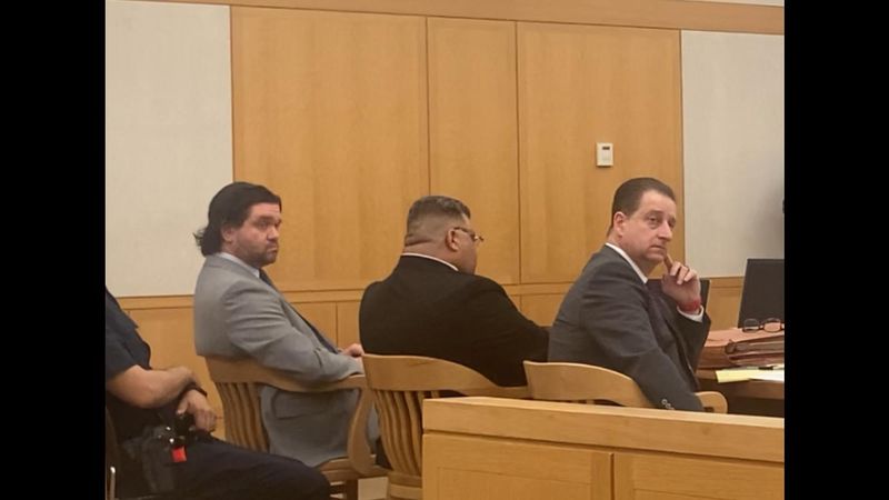 John Singh sits between defense lawyers Daniel Harnick and Richard Ferrante on May 19, 2026, as his murder trial begins in Westchester County Court. Singh is accused of stabbing his brother-in-law Bernard Barua to death on Nov. 16, 2024, in Barua's apartment on Bronx River Road in Yonkers.
