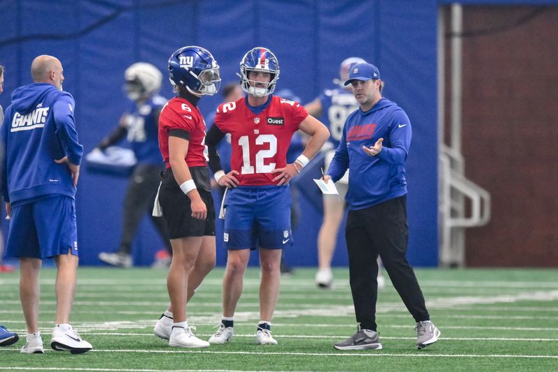 May 21, 2026; East Rutherford, NJ, USA; New York Giants quarterback Jaxson Dart (6) and quarterback Brandon Allen (12) participate in a drill during organized team activities at Quest Diagnostics Training Center. Mandatory Credit: John Jones-Imagn Images